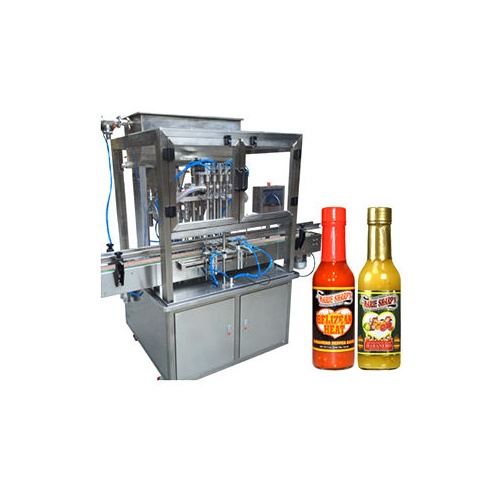 عکس دستگاه پرکن و دو بطری سس پر شده