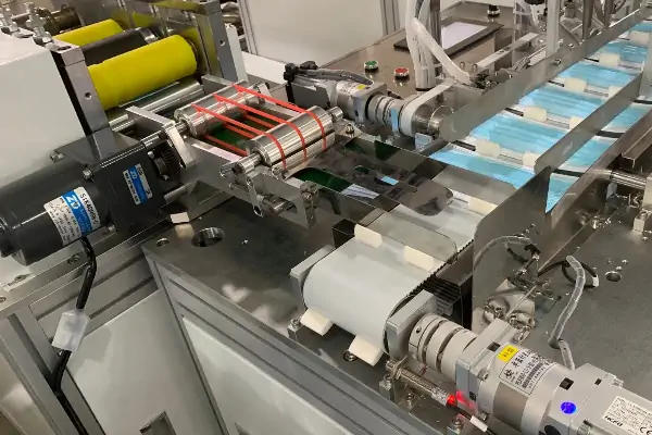 عکس دستگاه تولید کاور سر  همراه با کلاه آکاردئونی