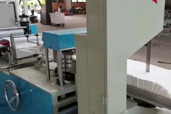 عکس دستگاه تولید پیشبند دندانپزشکی یکبار مصرف آبی رنگ